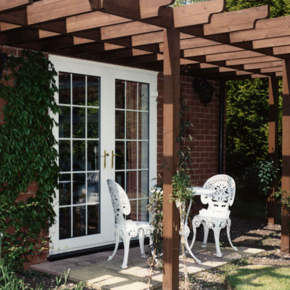 Classic French door leading to a cozy courtyard